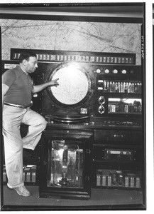 Man exhibiting Air Traffic Control equipment at the Burbank Airport, 1937