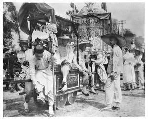 Men and women in traditional Chinese costume at La Fiesta in Los Angeles, ca.1901