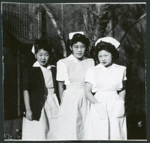 Photograph of nurses standing in front of the Manzanar hospital