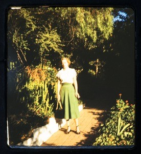 Milner family party, woman in garden, ca. 1950s