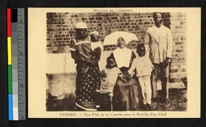 Missionary sister seated with others, Congo, ca.1920-1940
