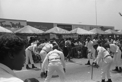 Gladiators group participating in a street festival, Los Angeles, 1983