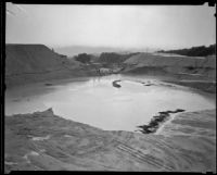 Remaining pond in a runoff area following a catastrophic flood and mudslide, La Crescenta-Montrose, 1934