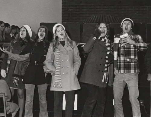Students singing Christmas carols at Convocation, circa 1974