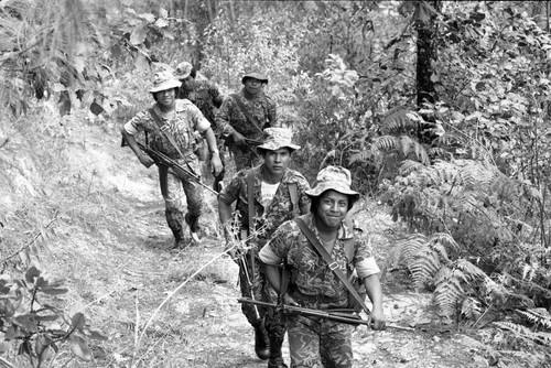 Soldiers patrol mountainous terrain, Guatemala, 1982