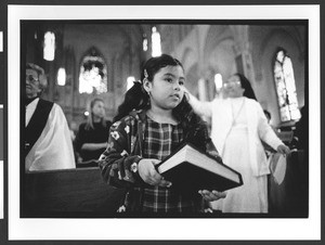 People of Filipino origin attending mass, interior of Saint Patrick's Catholic Church, San Francisco, California, 2002