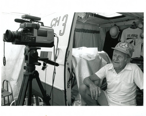 Bob Osborn sitting in news van, 1990