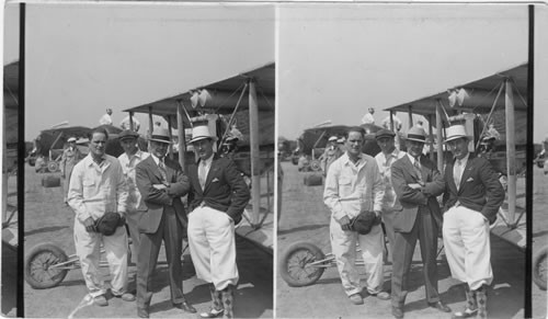 Al Williams & Capt. Dolittle. Air Aces in front of old Plane. The Flying Major James H. Dolittle (at left with folded arms) who linked the Three Capitals of Ottawa, Washington, and Mexico City. [Aug. 24, 1930]