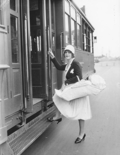 Woman, baby, board trolley