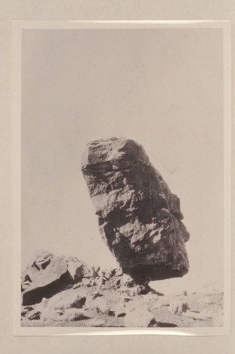 Balance [sic] rock one-half mile north of mouth of Nokai Creek. Rock (DeChelly sandstone) 30 ft. long, 25 ft. high, 15 ft. wide, on base of shale (Moenkopi) 5 ft. high, 8 ft. long and 4 ft. wide. Looking southwest at end of rock