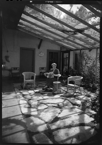 Bayly, Harold, residence. Woman in sunroom