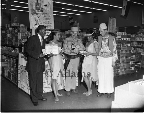 Men and women at store promotion, Los Angeles, ca. 1957