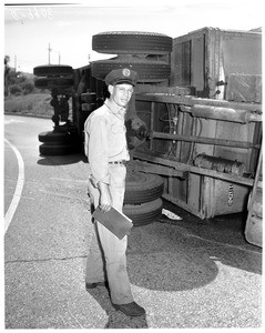 Truck overturned at 7th Street turnoff of Santa Ana Freeway, 1954