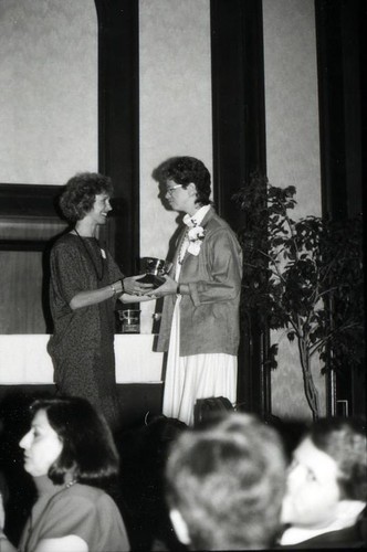 Woman receiving an award
