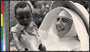 Missionary sister holding an infant, Congo, ca.1920-1940