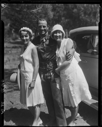 Actor Reginald Denny and two women, Lake Arrowhead Rodeo, Lake Arrowhead, 1929