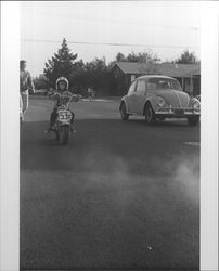 Unidentified boy on a motorcycle in Petaluma, California, 1973