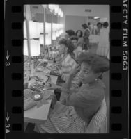 Kimolin Smith and other contestants applying their make-up before the Miss Inglewood Pageant, Calif., 1984