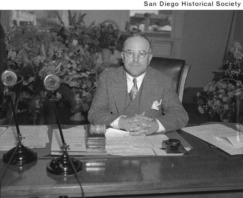 San Diego Mayor Percy J. Benbough seated at a desk