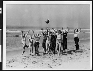 Women at a Los Angeles area beach tossing a ball, ca.1930