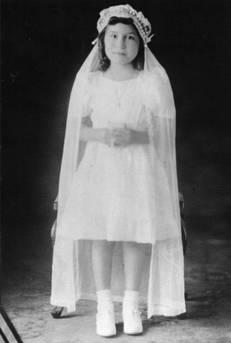 Girl dressed for first communion