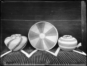 Three Indian baskets on display, ca.1900