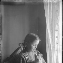 Young girl posing in window