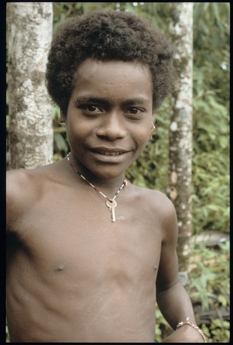 Young man with key around neck