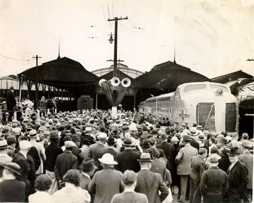 [Large crowd of people on a railway station platform next to the "City of San Francisco" streamlined train]