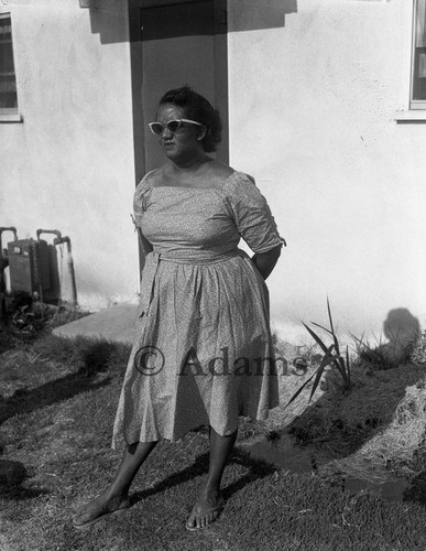 Woman in front of house, Los Angeles, 1961