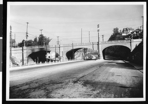 Concrete viaduct crossing a street and railroad tracks