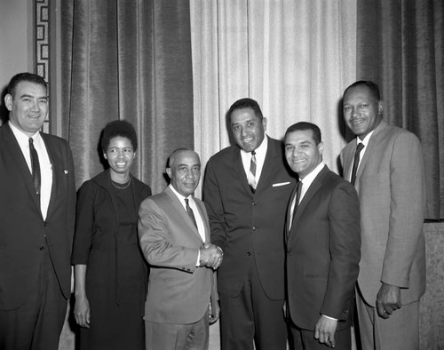 Don Newcombe posing with Los Angeles city council members and Burnistine McClaney, Los Angeles, 1967