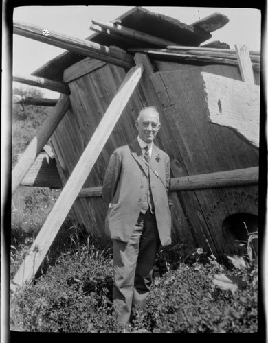 Carroll S. Hartman in front of a Yurok house, Requa, California
