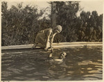 [Mary Pickford and Douglas Fairbanks in pool]