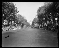 View of the start of the Tournament of Roses Parade route on S. Orange Grove Blvd. towards Goodhue Flagpole, Pasadena, 1929