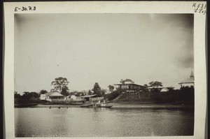 Mission station in Bonaberi on the Wuri River. English Trading Store, Middle School, water tank, church