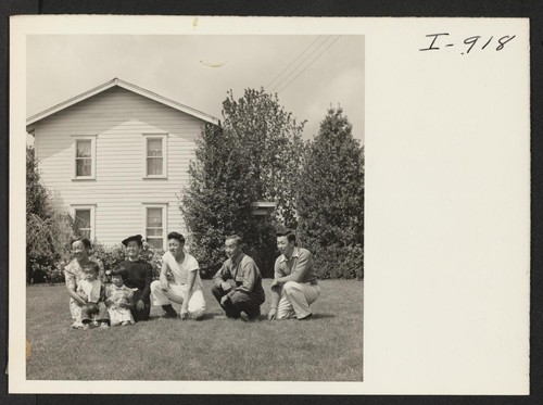 The Asakawa family is shown on the lawn of their home near Gresham, Oregon. Formerly residents of Hunt, Idaho, the