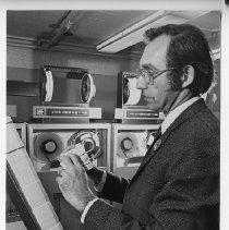 Louis Corsiglia examines computer punch cards