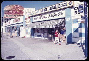 Signs & billboards along a Los Angeles street, ca. 1973