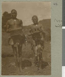 Two men displaying bricks, Chogoria, Kenya, ca.1924