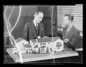 Boy with model house, Southern California, 1936