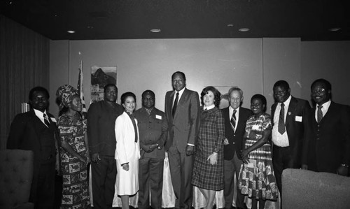 Tom Bradley and others pose together at an International Club of Los Angeles event, Los Angeles, 1981
