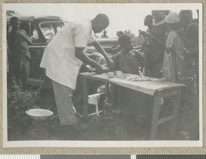 Patient prepares for treatment, Eastern province, Kenya, ca.1949