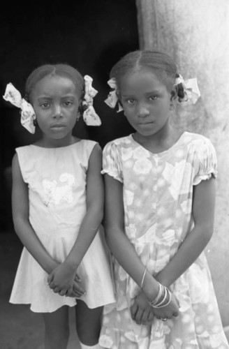 Two girls posing for a portrait, San Basilio de Palenque, 1976