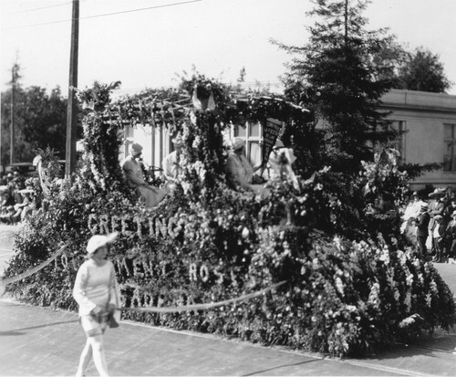 Greetings Tournament Roses Pasadena float in the Rose Parade