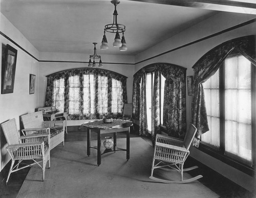 Sunroom with wicker furniture and table