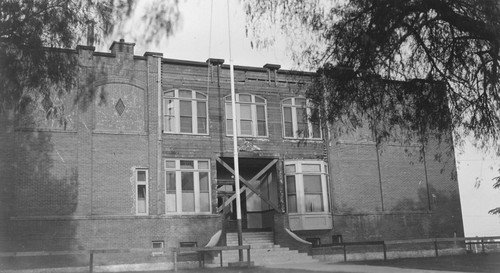 Unidentified school, closed with barriers over the front entrance