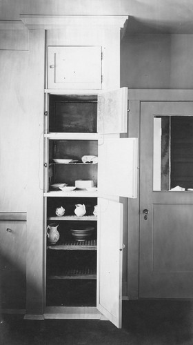 Interior detail of a cupboard and cooler