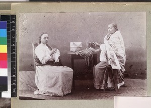 Portrait of women sewing, one with sewing machine, Madagascar, ca. 1913