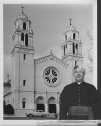 Monsignor Tillman in front of Saint Vincent de Paul Church, Petaluma, California, about 1960
